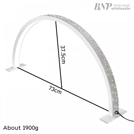 A white half moon-shaped LED lamp with a glittering surface, designed for nail/eyelash extension applications, with dimensions labeled.