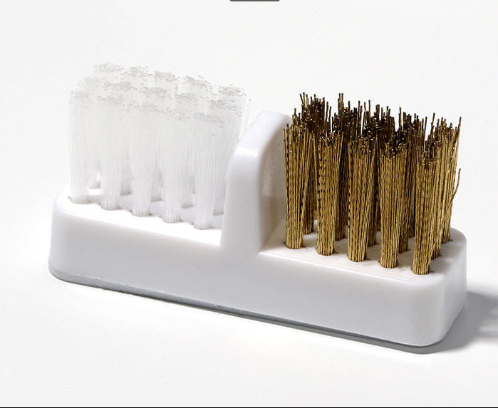 Cleaning brush with white bristle head and brown bristle head on a white background