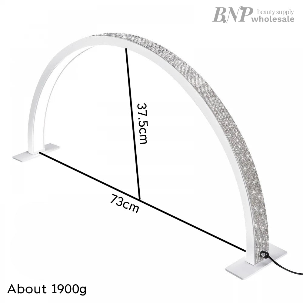 A white half moon-shaped LED lamp with a glittering surface, designed for nail/eyelash extension applications, with dimensions labeled.