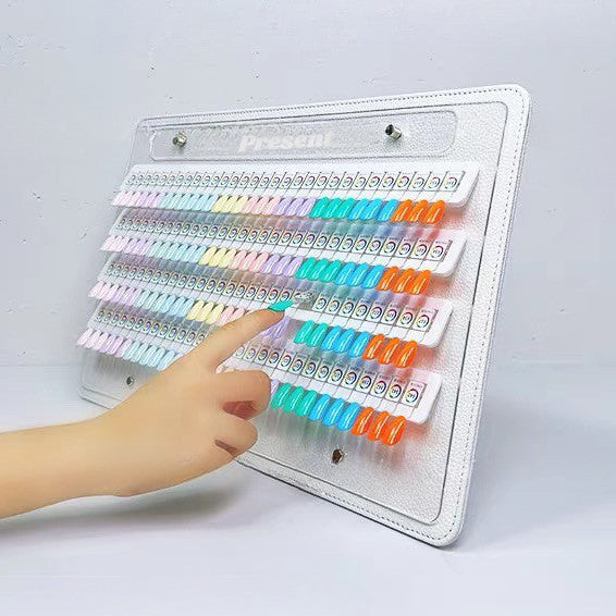 Colorful stamp set on a white background with a hand trying out the different color